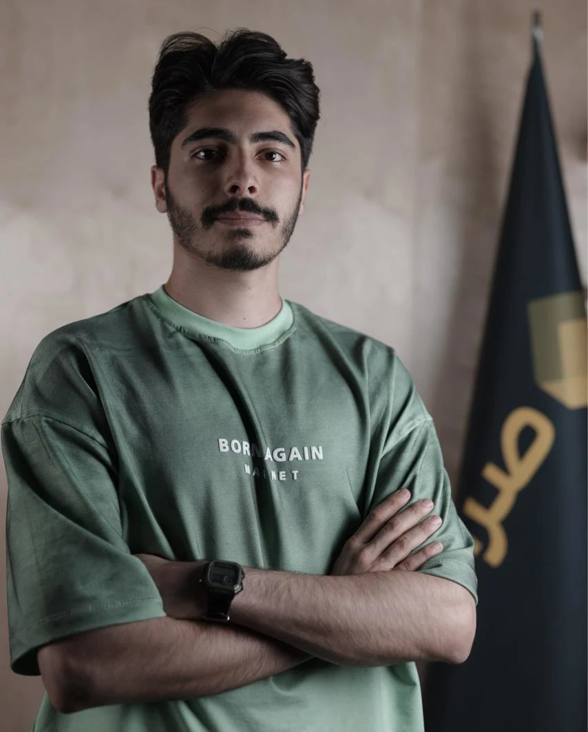Yasin Dehfuli standing with his arms crossed